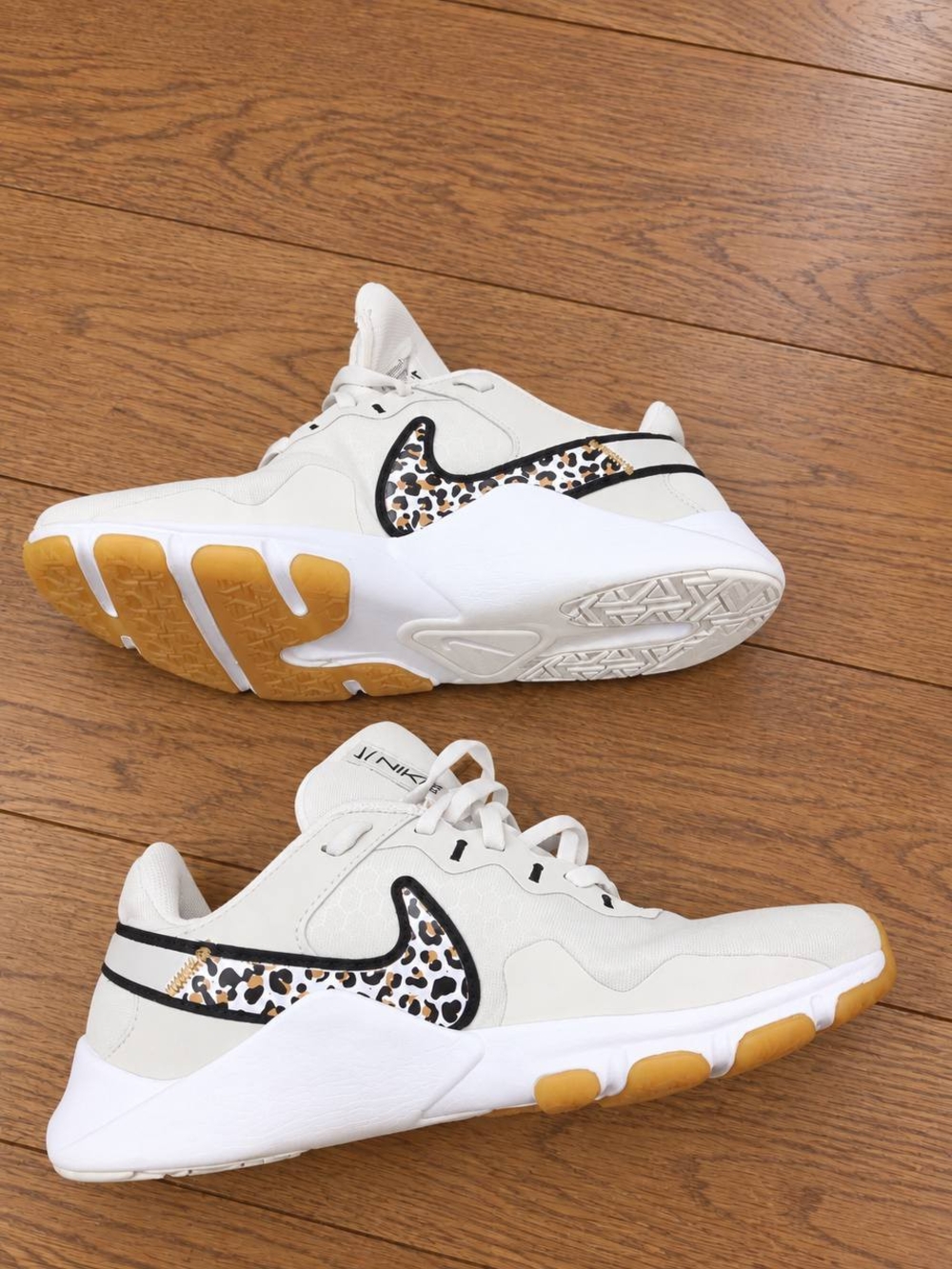 Nike Women's White Sneakers with Leopard Swoosh